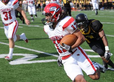 Nick Gallina escapses a Husky defender